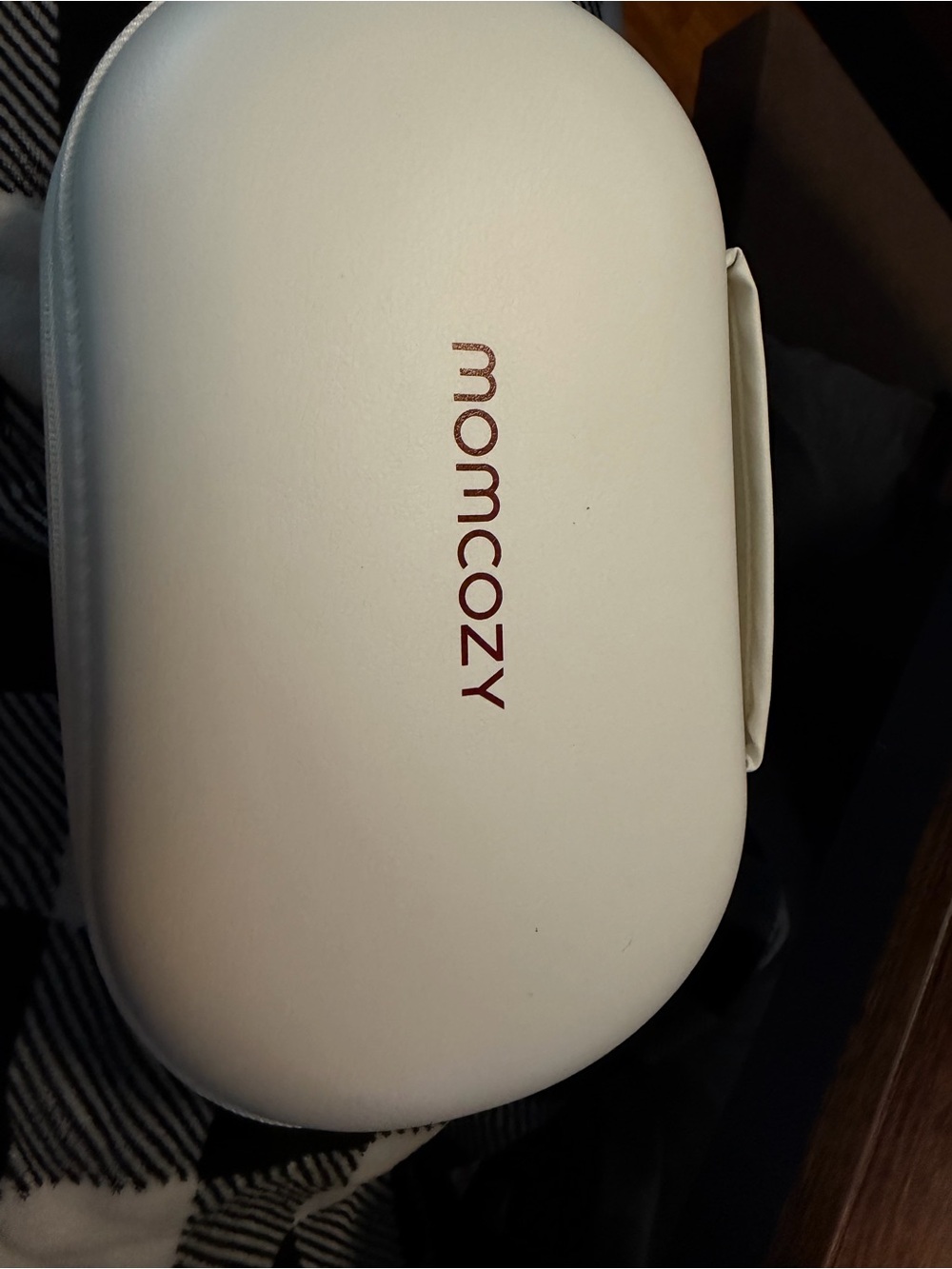 Momcozy White wearable women’s breast pumps.